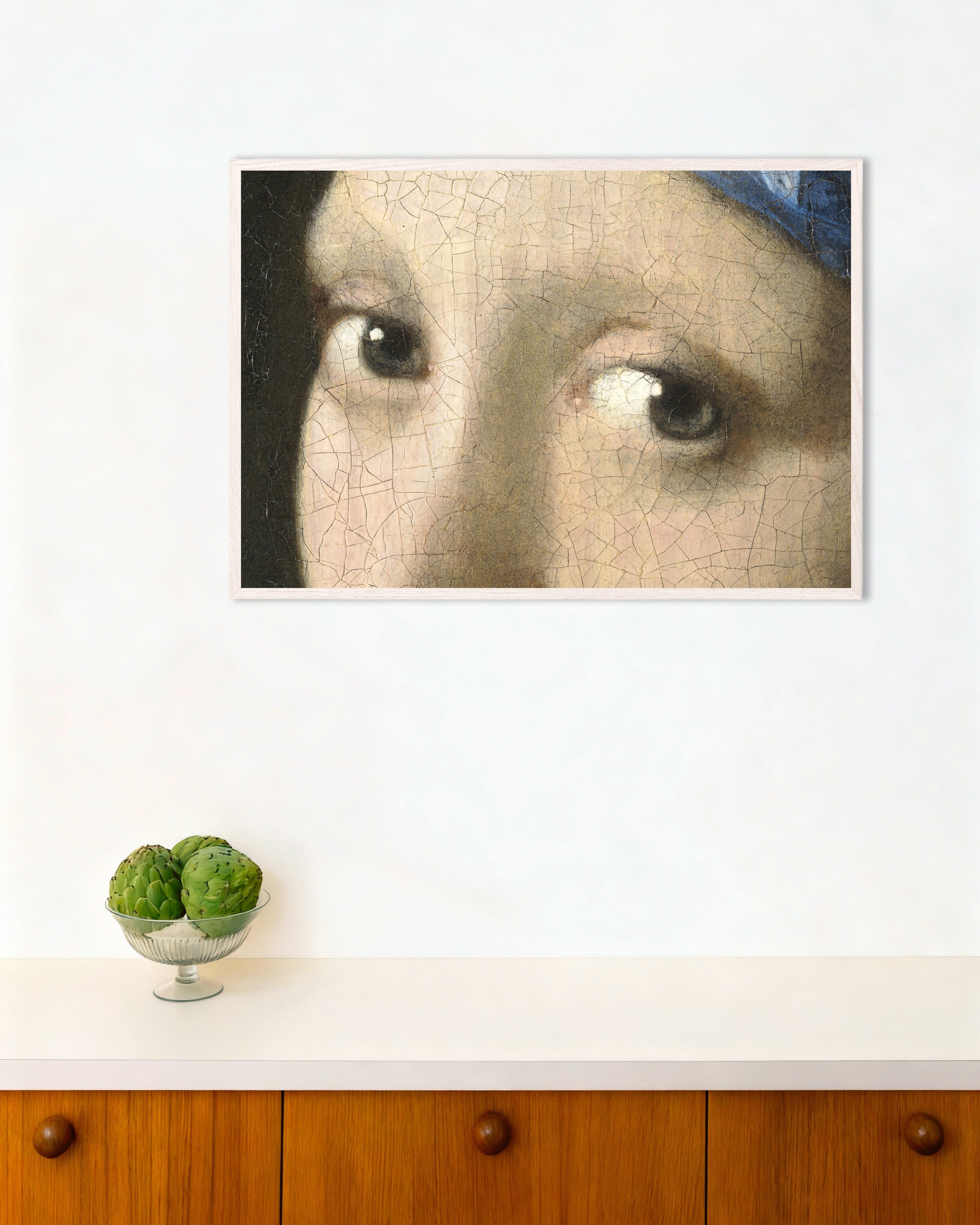 Poster of The Gaze - Eyes from Vermeer’s Girl with a Pearl Earring, with white wooden frame